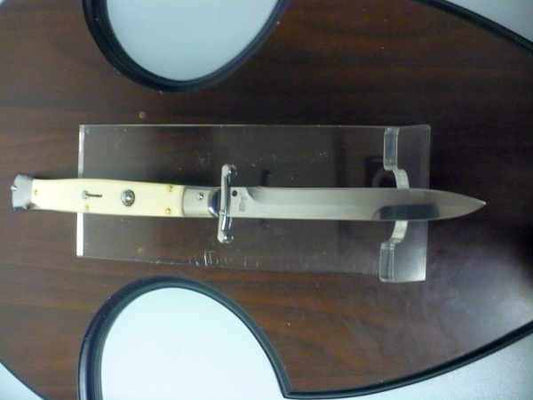 Classic swinguard Italian stiletto with imitation ivory handle and polished bayonet blade