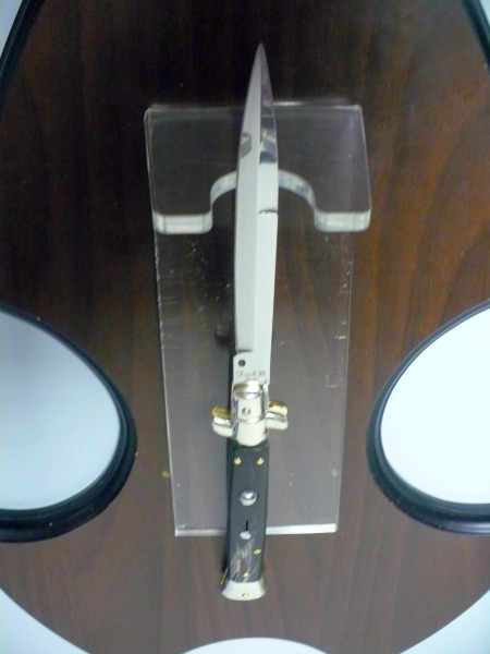 Picklock - Frank Beltrame Italian stiletto with a long silver bayonet blade, dark handle, and brass details